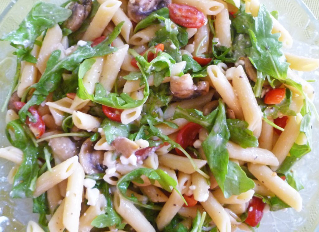 Warm Mushroom and Arugula Pasta Salad Warm Mushroom and Arugula Pasta Salad -- Peppery arugula, warm mushrooms, and juicy tomatoes make this pasta salad unforgettable. #pasta salad #low fat | thishappymommy.com
