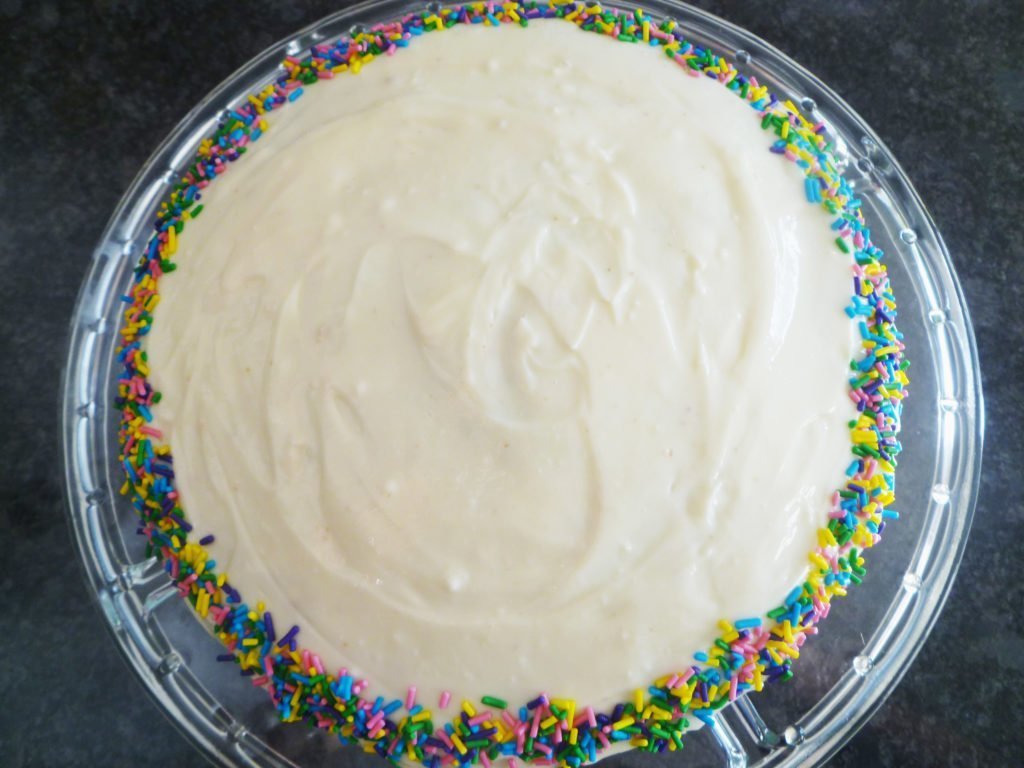 Brightly coloured for any celebration - sprinkles are baked right into the light and airy cake batter. Looking for the perfect party cake? Angel Food Birthday Cake with Cream Cheese Frosting is bound to impress. With light, airy batter and rich, creamy frosting, everyone will be lining up, especially when they see the colourful surprise inside - sprinkles! | thishappymommy.com