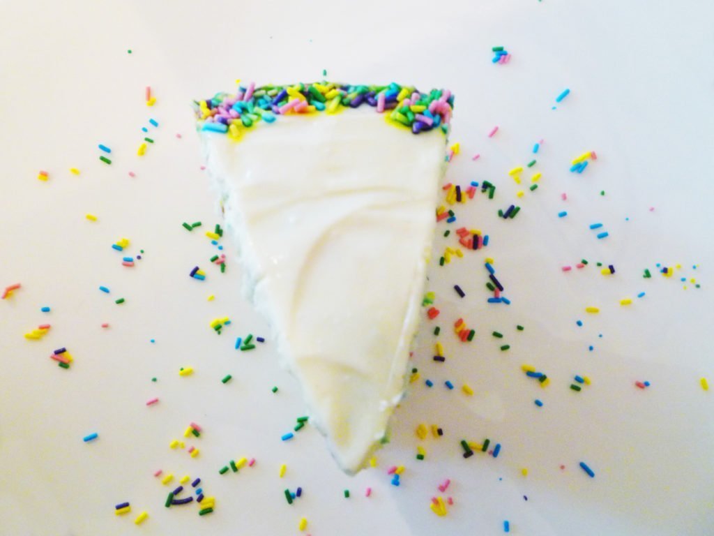 Brightly coloured for any celebration - sprinkles are baked right into the light and airy cake batter. Looking for the perfect party cake? Angel Food Birthday Cake with Cream Cheese Frosting is bound to impress. With light, airy batter and rich, creamy frosting, everyone will be lining up, especially when they see the colourful surprise inside - sprinkles! | thishappymommy.com
