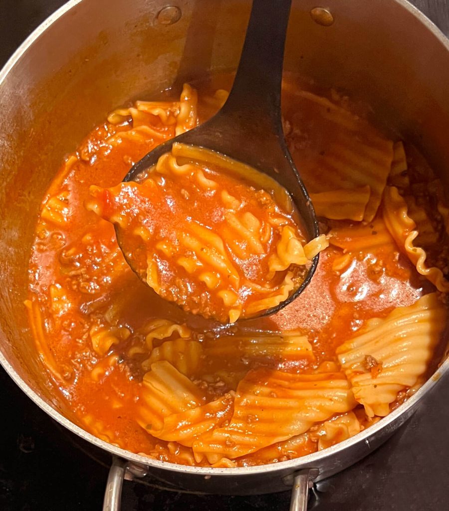Lasagna Soup - using a ladle to lift up the soup