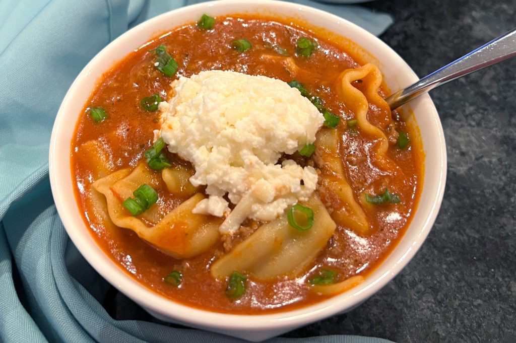 Easy Lasagna Soup is everything you love about classic lasagna, but in a cozy, savory soup! Tender noodles, hearty ground beef, a rich tomato broth, and two irresistible cheeses come together for a one-pot meal that’s pure comfort in a bowl!! Perfect for busy weeknights or when you’re craving a warm, cheesy hug in soup form!! | thishappymommy.com
