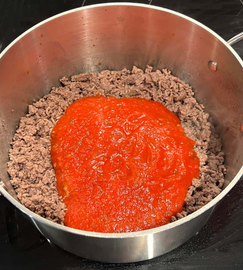 Lasagna Soup - adding marinara to make the soup broth